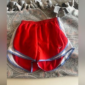 red and light blue nike shorts
